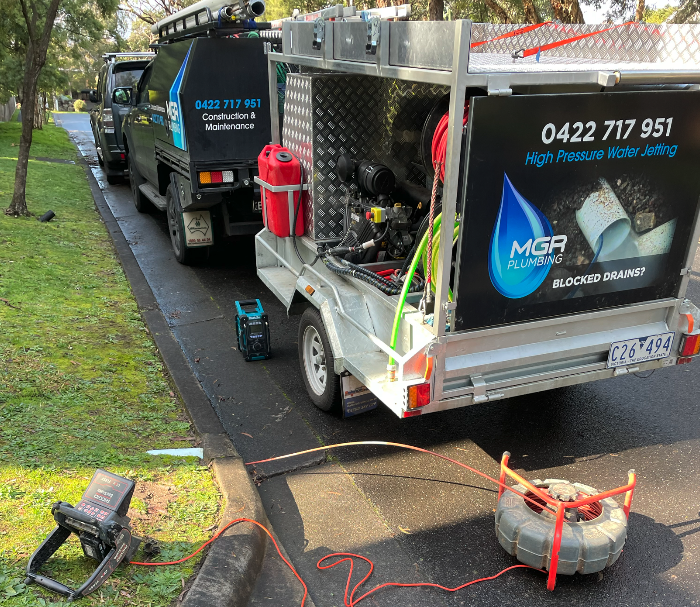 a car with a trailer for pressure hose