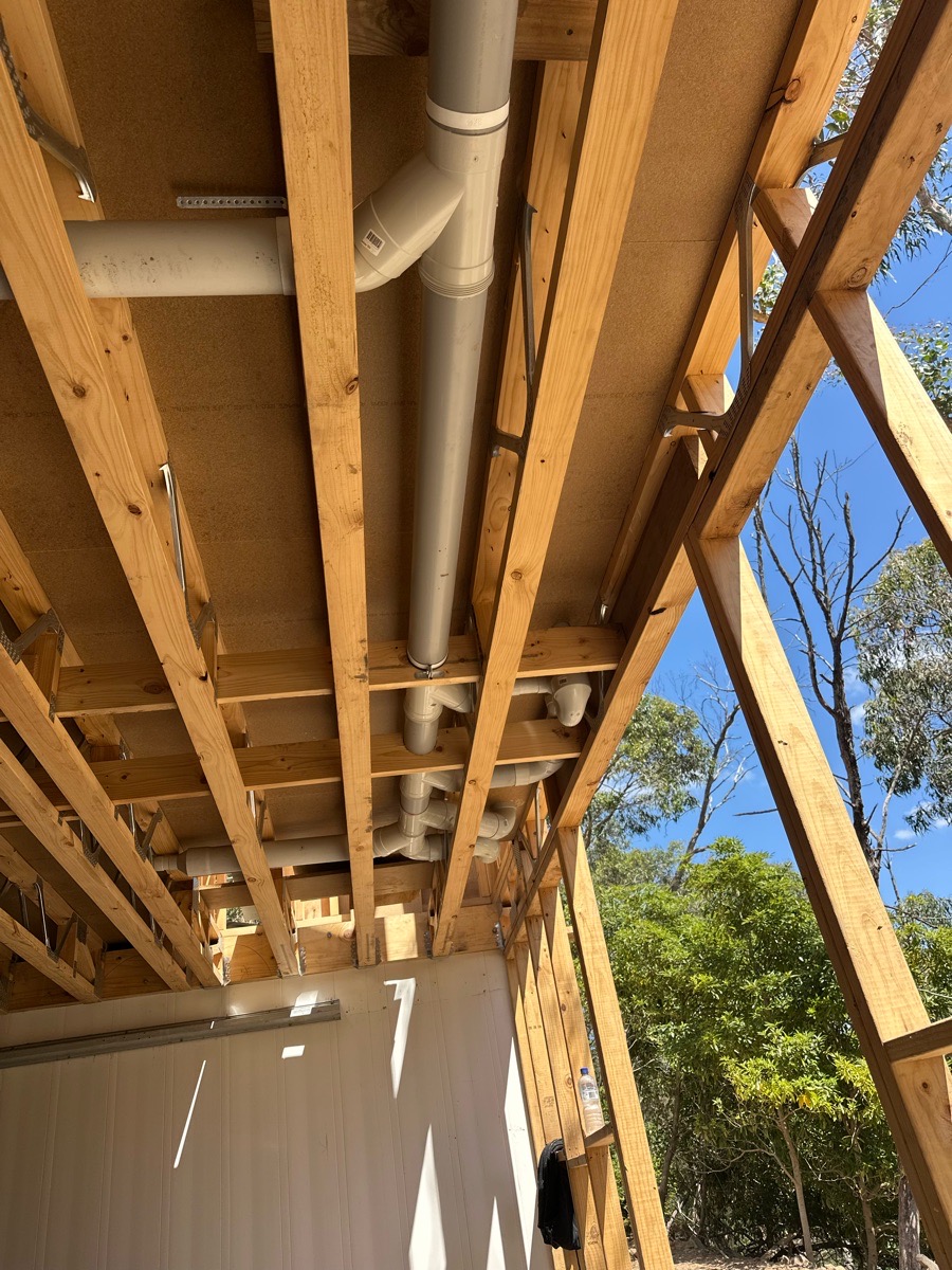 image of pipes in a wall of a new building
